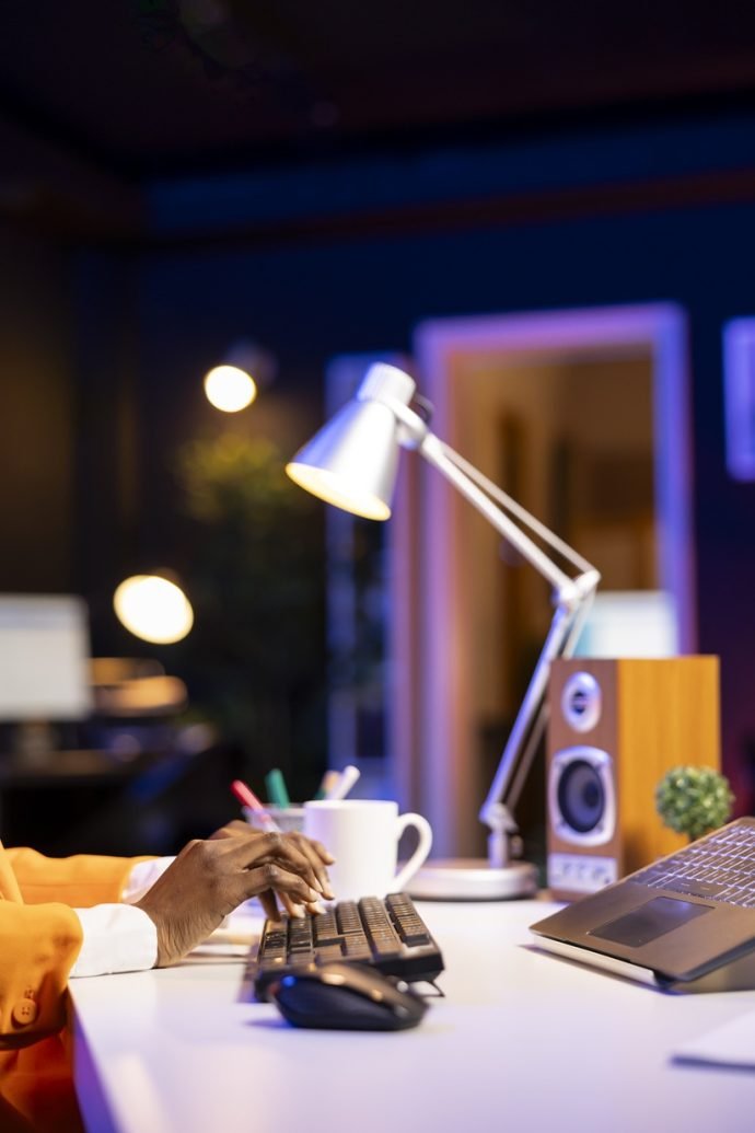 Freelancer working from home, typing on laptop keyboard, writing in document. Close up shot of remote worker pressing keys on notebook keyboard, sending emails to coworkers